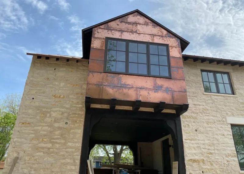 Copper metal panel facade on a stone building for Skylight Installation in West Palm Beach