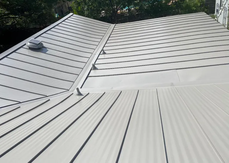 Solar attic fan installed on a metal roof for Roof Ventilation in West Palm Beach